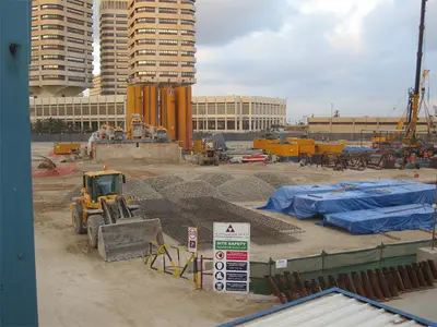 The development includes two towers for hotel and office use, featuring a four-level basement